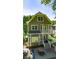 Exterior rear view of a two-story home with a deck, fire pit, and outdoor seating at 891 Paoli Se Ave, Atlanta, GA 30316