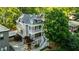 Aerial view of three-story house with multiple decks and lush green landscaping at 891 Paoli Se Ave, Atlanta, GA 30316
