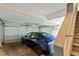 Interior view of attached garage with electric car charger and overhead door at 891 Paoli Se Ave, Atlanta, GA 30316