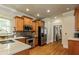 Spacious kitchen with stainless steel appliances, hardwood floors, and modern countertops at 891 Paoli Se Ave, Atlanta, GA 30316