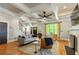 Cozy living room with hardwood floors, a fireplace, and large windows for natural light at 891 Paoli Se Ave, Atlanta, GA 30316