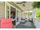Covered outdoor porch with ample seating provides a relaxing space at 891 Paoli Se Ave, Atlanta, GA 30316