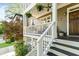 Close-up of the front porch with a wooden door, stairs, and porch railings at 891 Paoli Se Ave, Atlanta, GA 30316
