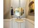 Stylish powder room featuring a pedestal sink and a round mirror at 891 Paoli Se Ave, Atlanta, GA 30316