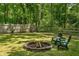 A charming backyard featuring a cozy fire pit and comfortable seating, perfect for outdoor relaxation at 1410 Cobb Branch Dr, Decatur, GA 30032