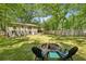 Expansive backyard with a fire pit and lush greenery, ideal for outdoor entertaining and Gathering gatherings at 1410 Cobb Branch Dr, Decatur, GA 30032