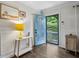 Bright entryway featuring a vibrant blue door, modern decor, hardwood floors, and wainscoting detail at 1410 Cobb Branch Dr, Decatur, GA 30032
