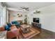 Bright living room featuring hardwood floors, modern decor, wainscoting, and a comfortable seating area at 1410 Cobb Branch Dr, Decatur, GA 30032