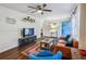 Stylish living room featuring hardwood floors, modern decor, wainscoting, and neutral wall colors at 1410 Cobb Branch Dr, Decatur, GA 30032
