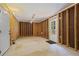 Unfinished basement with exposed framing, concrete floor, and back door access at 4044 Spring Cove Dr, Duluth, GA 30097