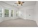 Airy bedroom boasts natural light, two closets, and neutral carpet at 4044 Spring Cove Dr, Duluth, GA 30097
