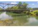Scenic view of the steel bridge over the waterway and community park amenities at 4044 Spring Cove Dr, Duluth, GA 30097
