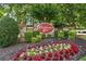 Charming community entrance sign for Chattahoochee Cove with lush landscaping at 4044 Spring Cove Dr, Duluth, GA 30097