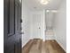 Bright entryway featuring hardwood floors and a staircase leading to the upper level at 4044 Spring Cove Dr, Duluth, GA 30097