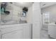 Well-organized laundry room equipped with washer, dryer, shelving, and storage space at 4044 Spring Cove Dr, Duluth, GA 30097