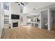 Spacious living room featuring a fireplace and an open layout connected to the kitchen at 4044 Spring Cove Dr, Duluth, GA 30097