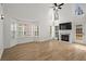 Bright and airy living room with a fireplace, and large windows at 4044 Spring Cove Dr, Duluth, GA 30097