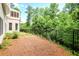 Fenced backyard offering privacy, with lush greenery surrounding the property at 740 Creek Wind Ct, Duluth, GA 30097