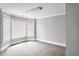 Bright bedroom with neutral carpeting, modern window blinds, and decorative trim at 740 Creek Wind Ct, Duluth, GA 30097