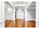 Elegant foyer with gleaming hardwood floors and classic white trim at 740 Creek Wind Ct, Duluth, GA 30097