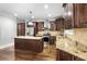 Modern kitchen with granite countertops, stainless steel appliances, and hardwood floors at 740 Creek Wind Ct, Duluth, GA 30097