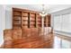 Spacious living room with custom shelving and a bright window at 740 Creek Wind Ct, Duluth, GA 30097