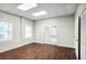 Home office with natural light, wood floors, and a closet for storage at 740 Creek Wind Ct, Duluth, GA 30097