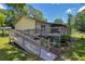 A wooden deck has access to a well-maintained backyard and lawn at 15 Porter Cir, Hampton, GA 30228