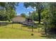 Fenced backyard with deck, patio and view of the home's exterior at 15 Porter Cir, Hampton, GA 30228