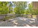 Wooden deck features railings and steps down to the lawn at 15 Porter Cir, Hampton, GA 30228