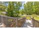 Backyard deck with a wooden railing at 15 Porter Cir, Hampton, GA 30228