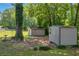 Two sheds with ample space for storage in the verdant backyard at 15 Porter Cir, Hampton, GA 30228