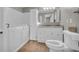 Bathroom featuring a walk-in tub, updated vanity, and neutral color palette at 15 Porter Cir, Hampton, GA 30228