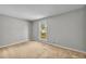 Bedroom featuring natural light, neutral paint, and carpeted flooring at 15 Porter Cir, Hampton, GA 30228