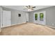 Bright bedroom features carpeted floors and French doors leading to a deck at 15 Porter Cir, Hampton, GA 30228