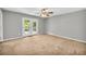 Cozy bedroom with neutral walls and French doors leading to a private deck at 15 Porter Cir, Hampton, GA 30228