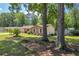 A lush lawn complements this traditional-style home with mature trees at 15 Porter Cir, Hampton, GA 30228