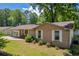 Well-maintained brick home featuring white trim and a tidy front yard at 15 Porter Cir, Hampton, GA 30228