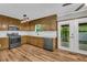 The kitchen features modern appliances and light-filled views to the rear porch at 15 Porter Cir, Hampton, GA 30228