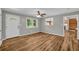 Living room features wood-look flooring and fresh modern gray paint at 15 Porter Cir, Hampton, GA 30228
