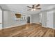 Living room with views of the kitchen and stainless appliances at 15 Porter Cir, Hampton, GA 30228