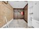 Unfinished storage room area with a closet, shelves, and concrete flooring at 15 Porter Cir, Hampton, GA 30228