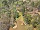 An aerial view displays the waterfront property, including shoreline, dock and boat lift at 2270 Emerald Dr, Jonesboro, GA 30236