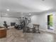Basement gym featuring modern exercise equipment and a walk out to a fenced backyard at 2270 Emerald Dr, Jonesboro, GA 30236