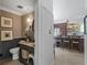 Charming powder room with decorative wallpaper, vanity, modern fixtures, and elegant design elements at 2270 Emerald Dr, Jonesboro, GA 30236