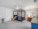 Spacious bedroom with a four-poster bed, soft carpet, and neutral decor at 2270 Emerald Dr, Jonesboro, GA 30236