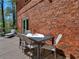 Inviting outdoor deck area featuring a dining table, chairs, and relaxing lounge space at 2270 Emerald Dr, Jonesboro, GA 30236