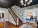 View of the foyer with hardwood floors, staircase, and dining room views at 2270 Emerald Dr, Jonesboro, GA 30236