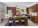 An inviting kitchen is well lit with a center island, and is outfitted with stainless steel appliances at 2270 Emerald Dr, Jonesboro, GA 30236