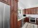 This modern kitchen showcases stainless steel appliances, custom cabinetry, and an eat-in breakfast area at 2270 Emerald Dr, Jonesboro, GA 30236